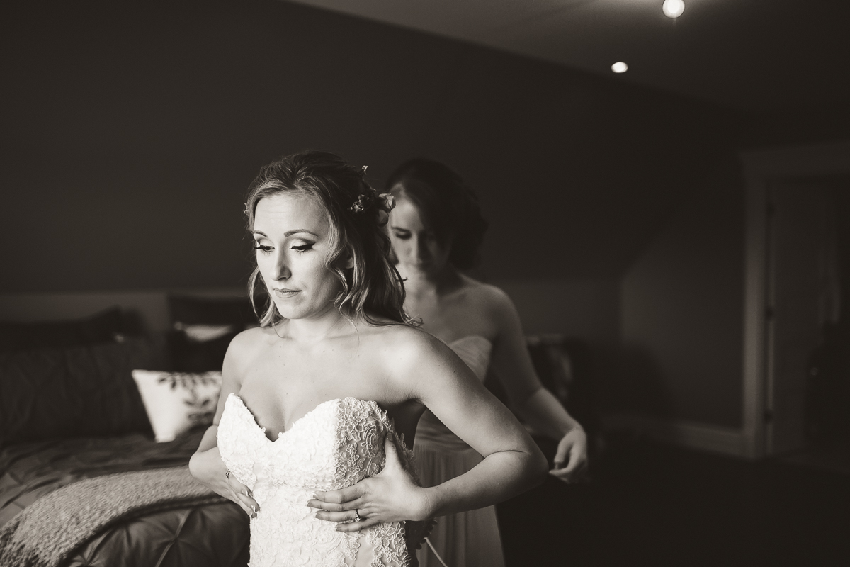 bride putting dress on