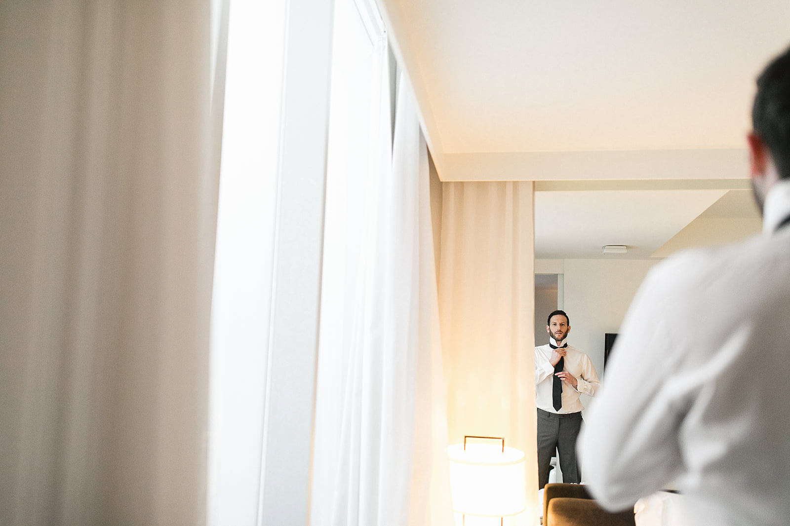 Groom getting ready at Thompson Hotel