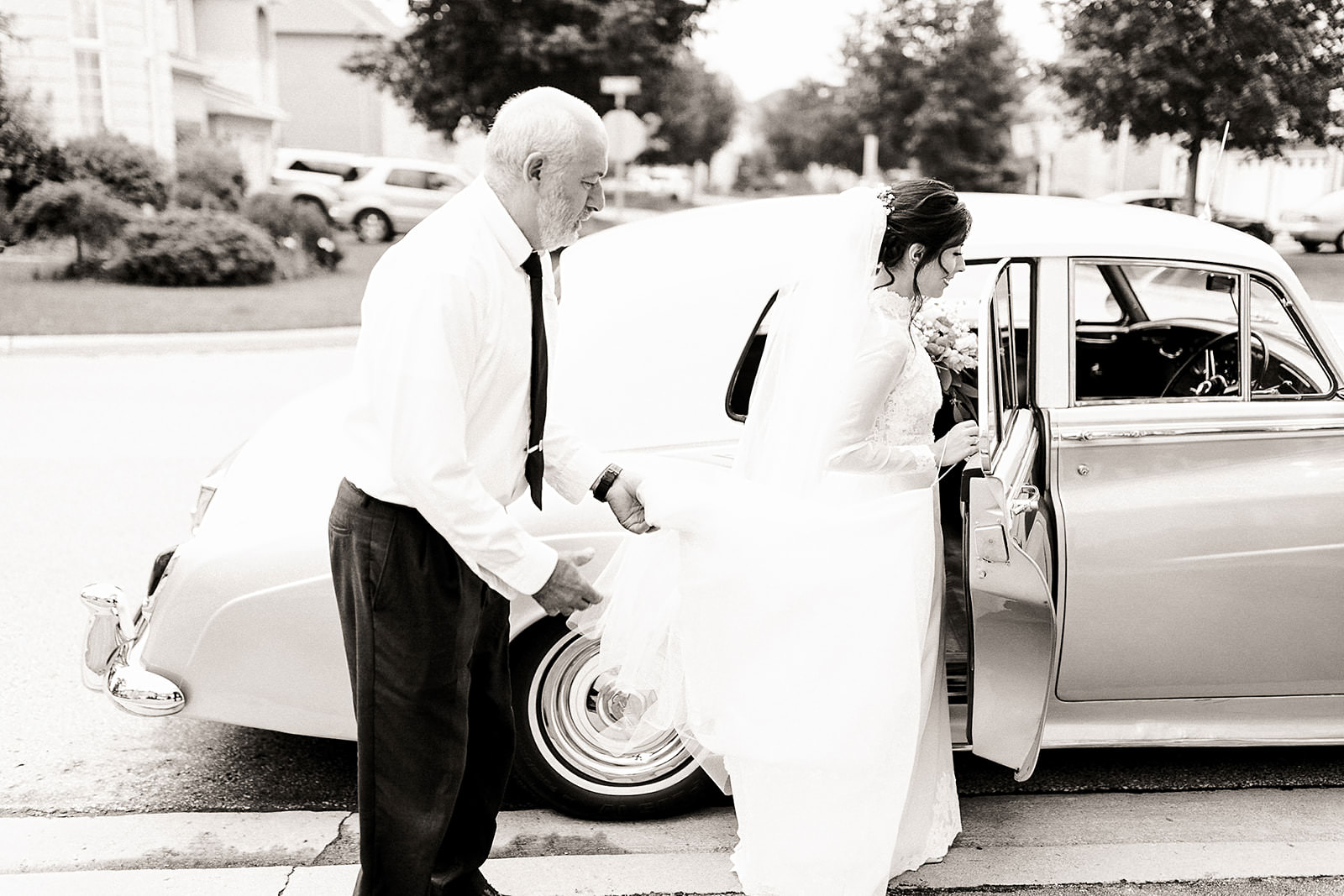 Bride getting into classic car wedding toronto