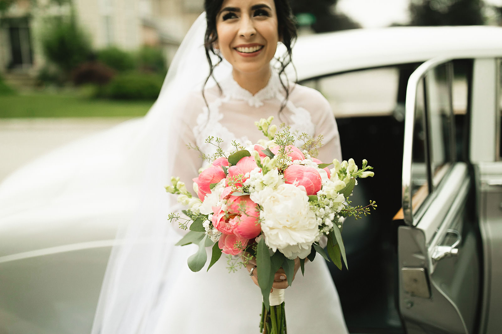 Bride getting into classic car wedding toronto