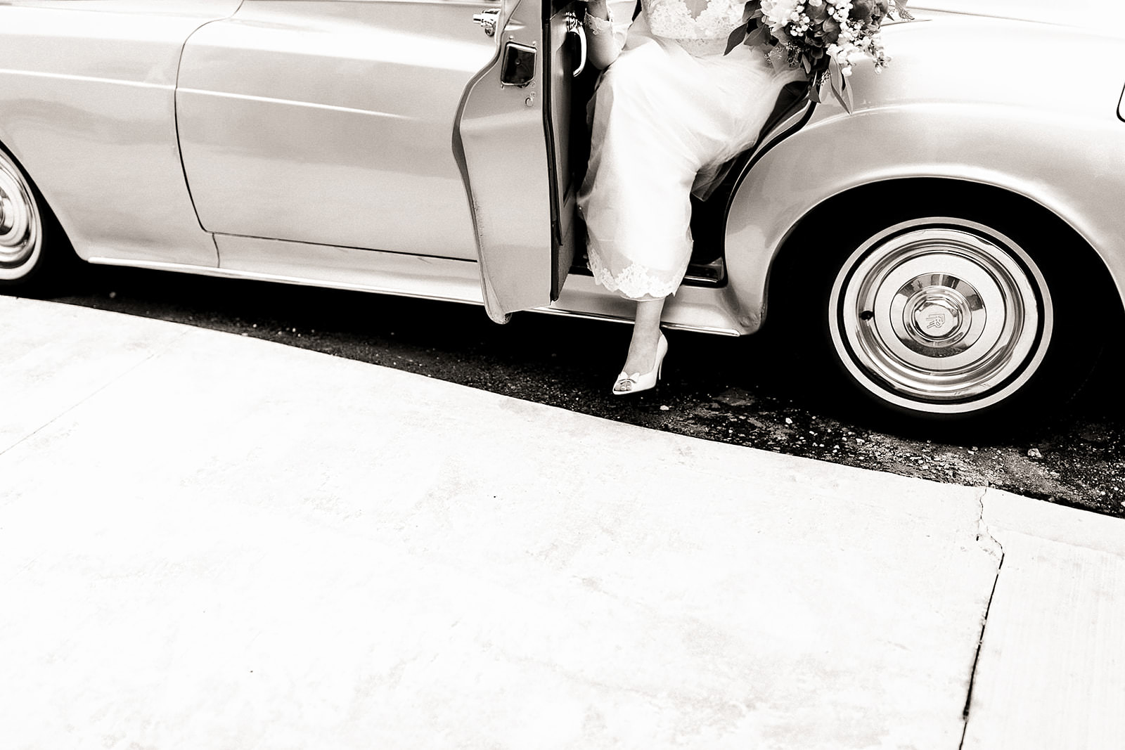 Bride getting into classic car wedding toronto